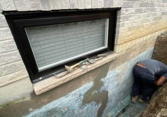 Exterior crack repaired under window