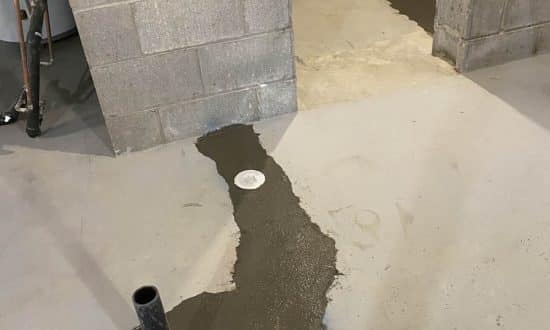 Connection to storm line and concrete finish with a trowel